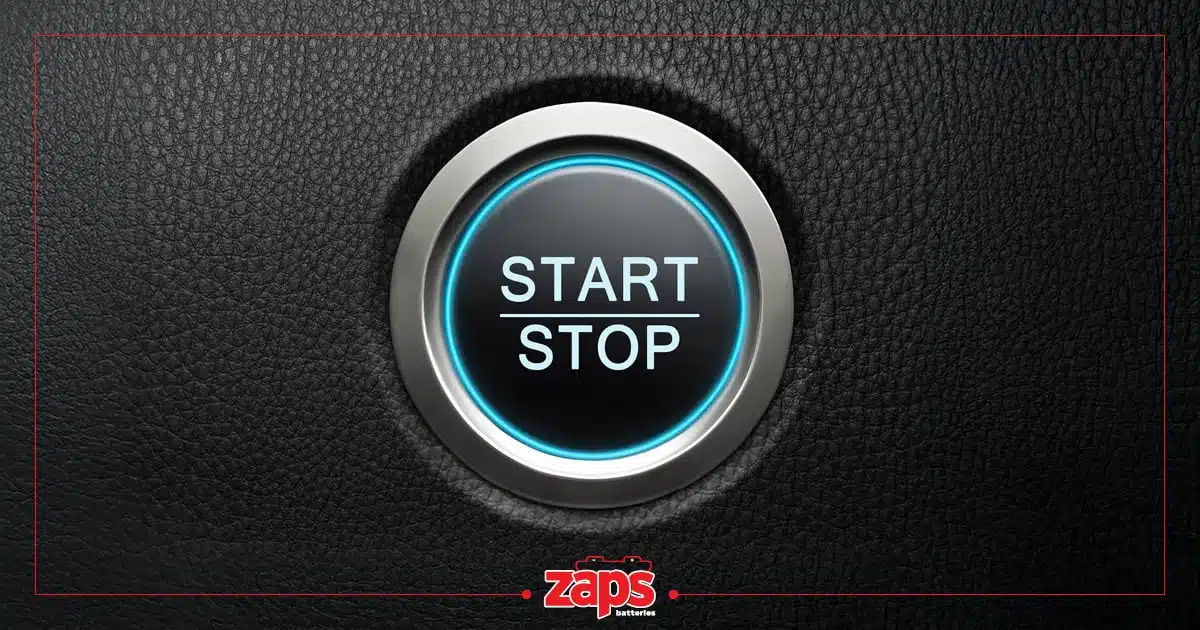 Κουμπί εκκίνησης Start-Stop αυτοκινήτου με μπλε φωτισμό σε δερμάτινο φόντο ZAPS